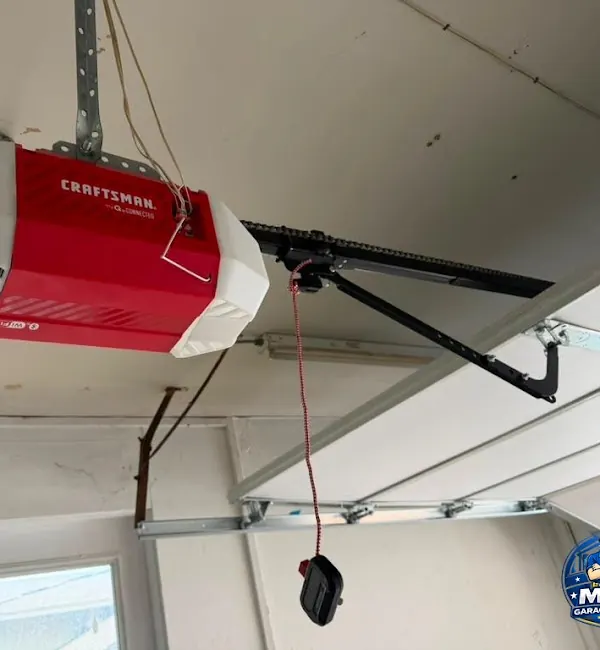 Ceiling-mounted residential garage door opener photographed for MTA Garage Doors