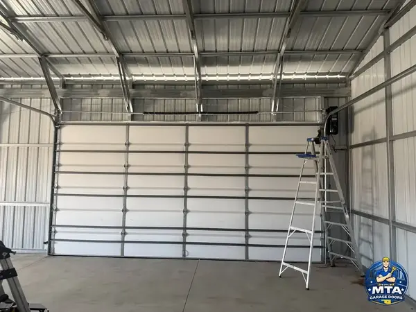Interior view of a commercial sectional overhead door photographed for MTA Garage Doors