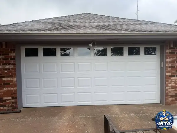 Windowed residential garage door project by MTA Garage Doors