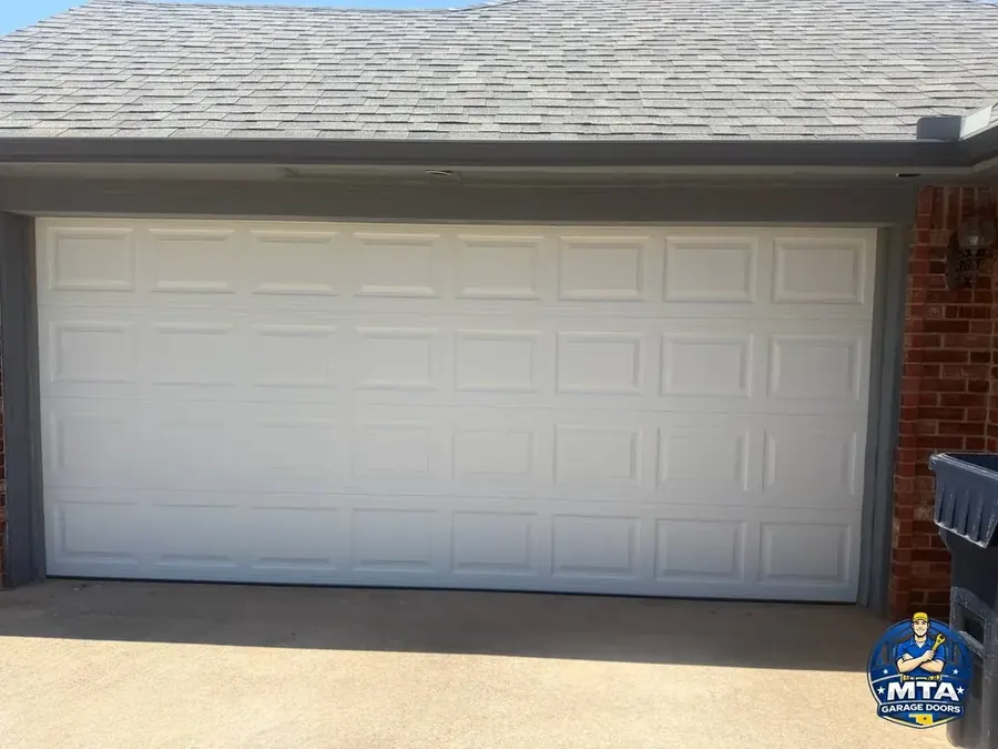 White residential sectional garage door photographed for MTA Garage Doors