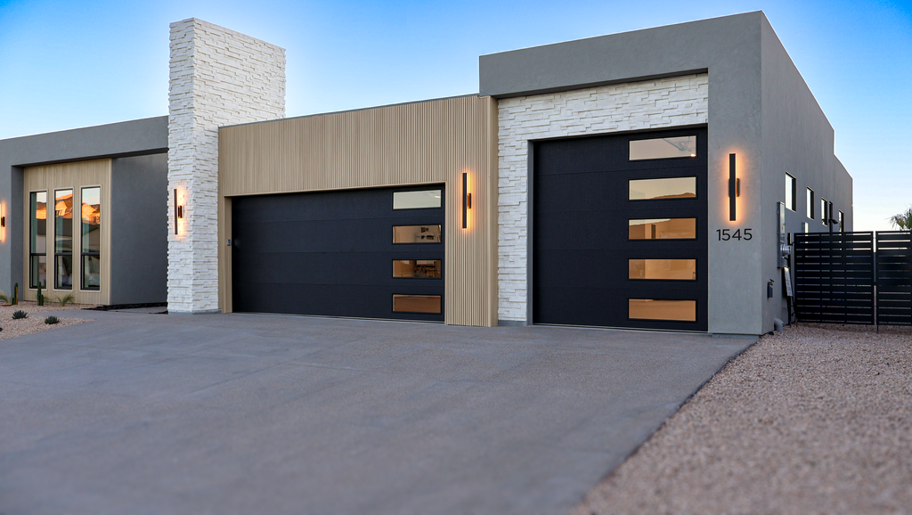 Reinforced garage door in a coastal home with storm shutters or high-wind setup visible